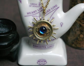 Brass and Glass Eye Pendant, Featured in "A Charmed Woman" Short Story