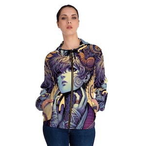 Peut inclure: Un sweat à capuche zippé violet et jaune avec un imprimé graphique d'une personne au visage bleu et des tatouages ​​complexes. La personne a une corne sur la tête et porte une tenue violette et jaune.