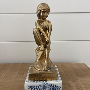 Vintage Brass Maitland Smith figurine on a porcelain blue and white base