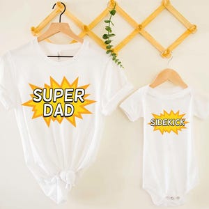 Super Dad Sidekick Shirt Set – Matching Dad and Kid Outfit – Father’s Day Superhero Shirts – Daddy and Me Gift Set – Comic Dad Baby Clothes