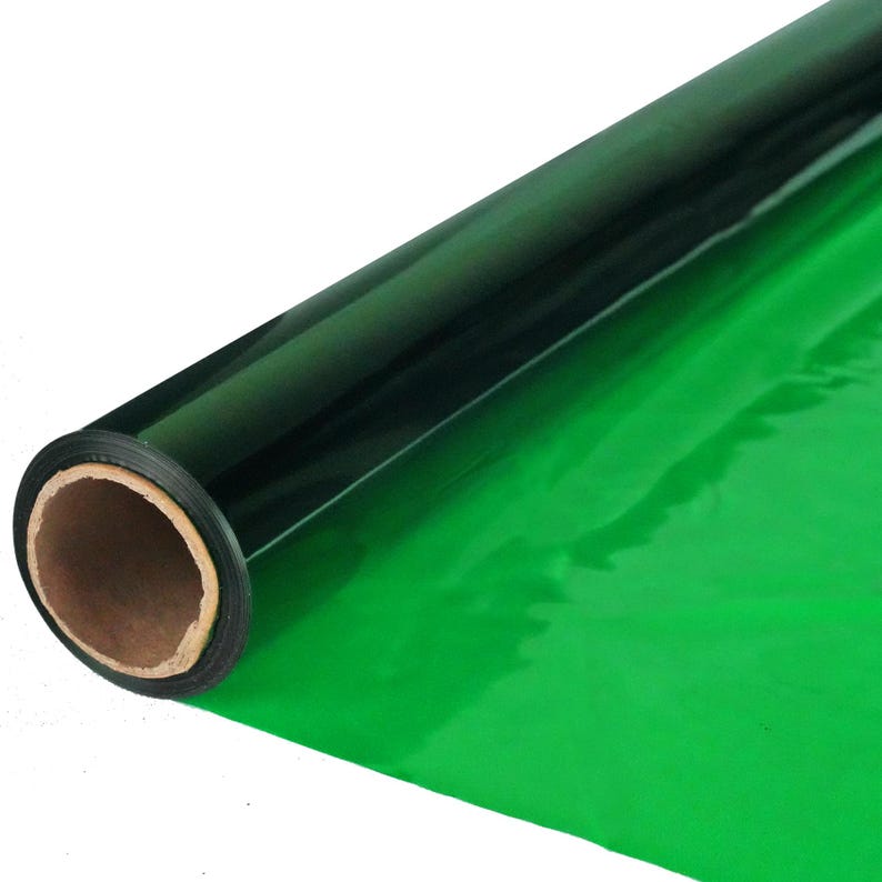 May include: A roll of green and black chroma key paper. The paper is rolled up and has a cardboard core.