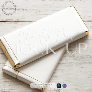 May include: Two white chocolate bar mockups with gold trim, stacked on a light wood surface. The bars have the words "Chocolate Bar MOCK UP" embossed on the front. The image also includes a logo and text that reads "PSD SMART OBJECT + JPG INCLUDED."