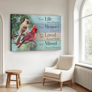 May include: A painting of two cardinals perched on a branch with red berries. The background is a blue and green woodgrain pattern. The text reads: "Your Life was a Blessing, Your Memory A Treasure, You Are Loved Beyond Words, And Missed Beyond Measure."