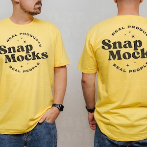 May include: Two yellow t-shirts with a black circle logo that says "Real Products Snap Mocks Real People".