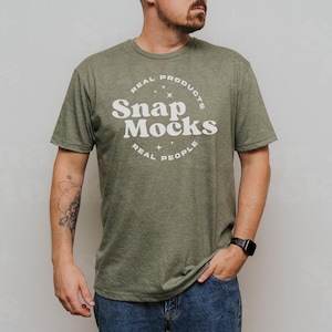 May include: A green t-shirt with a white circle logo that says "Real Products Snap Mocks Real People".