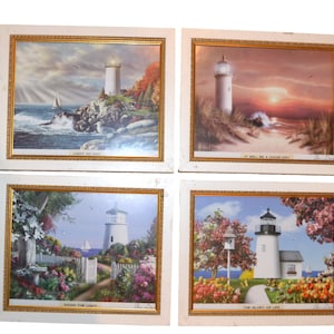 Leuchtturm-Kunst mit Küstenszenen Vier gerahmte Häuschen Beachy Waterfront