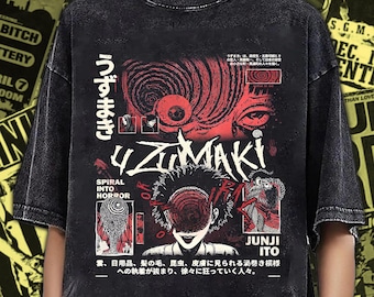 May include: Black graphic tee featuring the word "UZUMAKI" and artwork from Junji Ito's manga. The design includes red and white illustrations with Japanese text. The shirt has a vintage, distressed look.