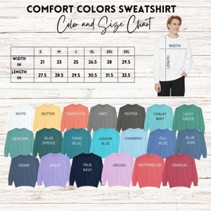 May include: A Comfort Colors sweatshirt color and size chart. The chart shows measurements in inches for width and length, ranging from size S to 3XL. The image displays a variety of sweatshirt colors, including white, butter, terracotta, grey, and pepper.