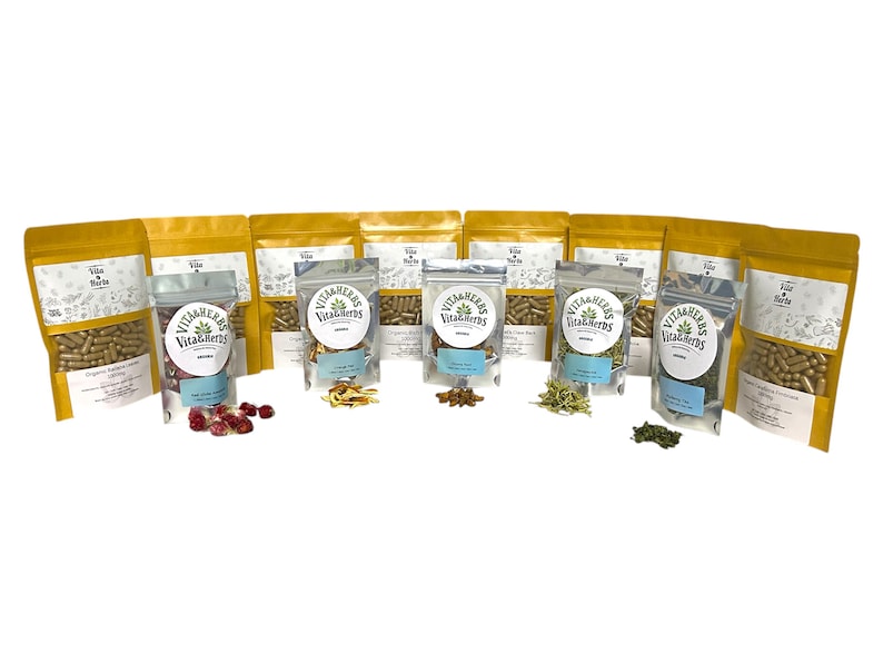 May include: An assortment of herbal products in gold and clear packaging. The products include capsules, dried herbs, and berries. Each package has a label with the text "Vita & Herbs".