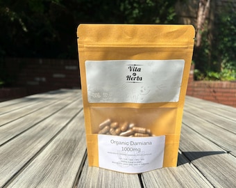 May include: A tan, resealable pouch containing brown capsules. The label features the text Vita & Herbs at the top and Organic Damiana 1000mg at the bottom. The pouch has a clear window in the center, revealing the contents inside the packaging.