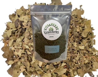 May include: A clear plastic bag filled with dried raspberry leaf, labeled "Dried Raspberry Leaf" and "Organic" by Vita & Herbs. The bag is surrounded by a pile of dried leaves, with a white background.