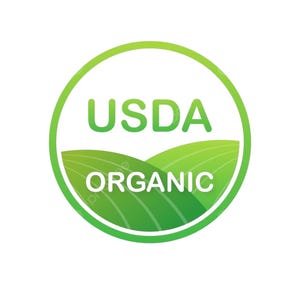 May include: A circular USDA Organic label with a green gradient border. The words "USDA" and "ORGANIC" are in green and white, respectively. The background features green rolling hills.