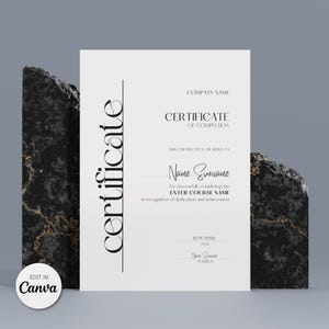 May include: A white certificate with black text, featuring the word "certificate" vertically. The certificate includes fields for a company name, recipient's name, course name, and date. The Canva logo is in the bottom left corner.