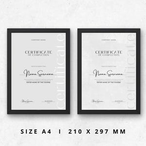 May include: Two black framed certificates with white backgrounds. The text on the certificates reads "Certificate of Completion." The certificates are sized for a standard A4 paper, which is 210 x 297 mm.