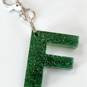 Glitter resin initial keyring/bag charm. Sparkly personalised letter keyring. Gifts, party bag fillers, favours. Resin letters handmade Green glitter