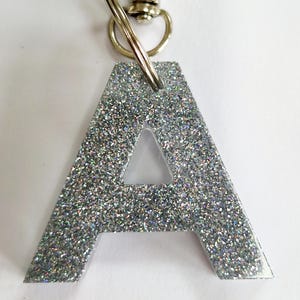 Glitter resin initial keyring/bag charm. Sparkly personalised letter keyring. Gifts, party bag fillers, favours. Resin letters handmade Silver glitter