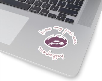 May include: A sticker with a pink lipstick print and the text "Kiss my peri-ene" and "helloperi" in a cursive font.