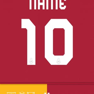 May include: A red and yellow football shirt with the number 10 on the front. The shirt features the team's logo and the name "Ali Sami Yen Stadyumu" with the stadium's location, capacity, and year built.