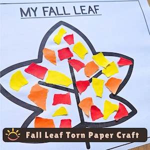 Puede incluir: Una hoja de papel blanco con el texto negro MY FALL LEAF en la parte superior y un gran contorno negro de una hoja. El interior de la hoja está relleno con pequeños trozos de papel de construcción rasgados de forma irregular en amarillo, naranja y rojo.