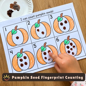 May include: A white paper worksheet titled I can count pumpkin seeds! featuring six numbered boxes, each containing an orange pumpkin illustration with a green leaf. Brown fingerprint dots represent seeds inside the pumpkins, matching the numbers one through six.