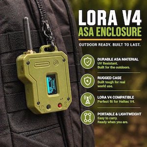 May include: An olive-green Lora V4 ASA enclosure with a black antenna, hanging from a black strap. The device has a small screen and the text "LORA V4 ASA ENCLOSURE" is visible. The text "OUTDOOR READY. BUILT TO LAST." is also visible.