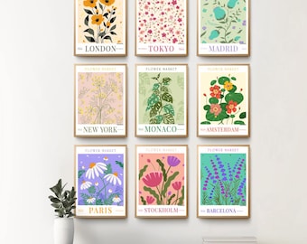 Peut inclure: Neuf illustrations colorées de fleurs avec le texte "Flower Market" et les noms des villes : Londres, Tokyo, Madrid, New York, Monaco, Amsterdam, Paris, Stockholm et Barcelone.