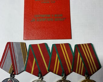 Three USSR medals for impeccable service. And a medal of veteran of the USSR armed forces with documents.