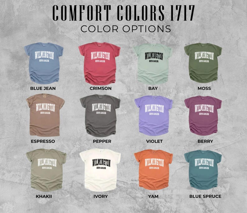 May include: An image showcasing a variety of Comfort Colors 1717 t-shirts in different colors. Each shirt displays the word "Wilmington" in white block letters. Color options include Blue Jean, Crimson, Bay, Moss, Espresso, Pepper, Violet, Berry, Khaki, Ivory, Yam, and Blue Spruce.