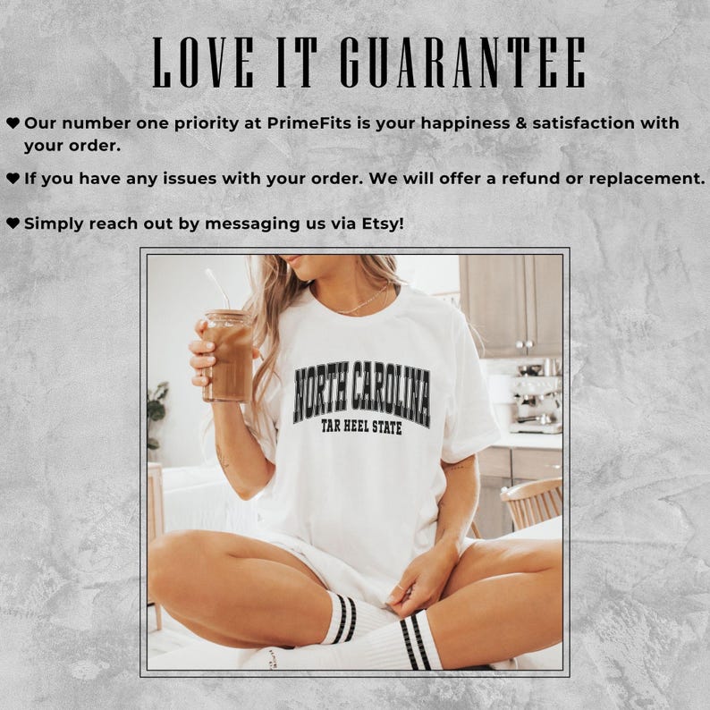 May include: White t-shirt with "NORTH CAROLINA TAR HEEL STATE" text in black. The person is holding a glass of iced coffee. The text "LOVE IT GUARANTEE" is at the top of the image.