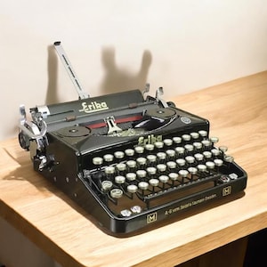 Máquina de escribir mecánica alemana Erika Black de los años 20: máquina de oficina manual antigua, totalmente funcional, regalo de decoración vintage para escritores y coleccionistas.