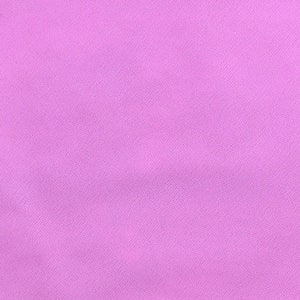 May include: A solid, light purple fabric with a smooth, even texture.
