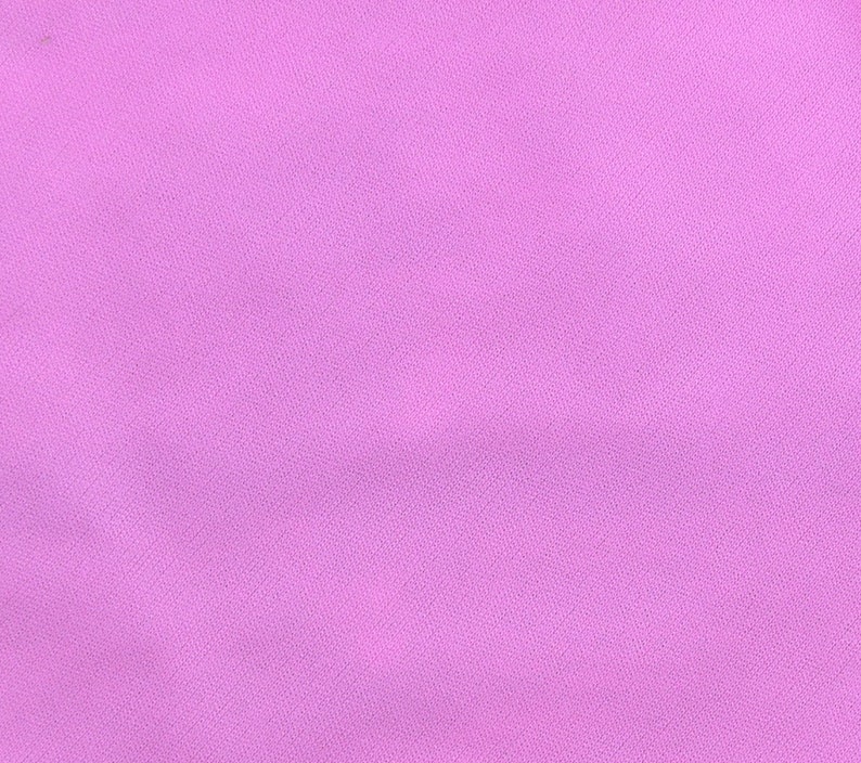 May include: A solid, light purple fabric with a smooth, even texture.