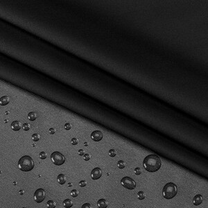May include: Black fabric with a smooth, water-resistant finish. Water droplets are visible on the surface of the fabric.