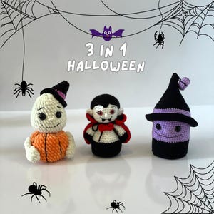 May include: Three crocheted Halloween characters: a ghost with a pumpkin, a vampire, and a witch. The characters are arranged on a white surface with a spider web background. The text "3 in 1 HALLOWEEN" is displayed above the characters.