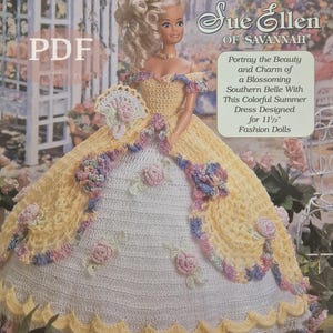 May include: A crochet pattern for a doll dress. The doll is wearing a yellow and white crocheted dress with floral accents. The text on the pattern reads "Sue Ellen of Savannah" and "Designed for 11 1/2" Fashion Dolls."