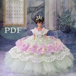 May include: A crochet doll dress pattern for a doll wearing a green and white dress with pink bows and a crown. The pattern is titled "Miss August 1997" and is an Annie Potter Original.