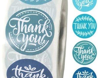 May include: A roll of round stickers with the words "Thank You" in white script. The stickers are various shades of blue and teal, with decorative floral and dotted border designs. Several individual stickers are also visible.