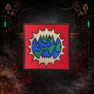 May include: A square patch with a red background and a stylized Earth design. The Earth is blue and green, surrounded by a beige sunburst design. The patch is likely for clothing or accessories.