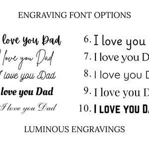 Engraving font options chart for personalized keychains and gifts. The image displays ten numbered font styles, each showing the sample text “I love you Dad” in different script, cursive, serif, sans-serif, and bold typefaces. The heading reads “Engraving Font Options,” with “Luminous Engravings” displayed at the bottom, helping customers choose a font for custom engraving.