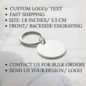 May include: A silver-colored, blank oval keychain with a ring. The keychain is 1.8 inches (3.5 cm) in size and can be engraved on the front and back. The image also includes text about custom logos and bulk orders.