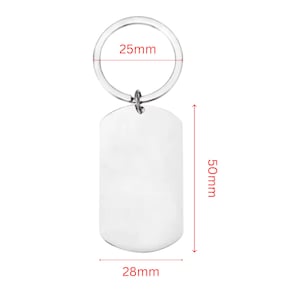 Product size guide for a personalized memorial keychain. The image shows a blank silver dog-tag-style keychain with measurement annotations indicating a 50 mm tag height, 28 mm tag width, and a 25 mm key ring diameter. The dimensions are displayed with red measurement lines on a clean light-gray background.