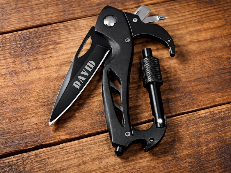 personalized engraved carabiner pocket knife with name David, multi tool EDC knife with seatbelt cutter and glass breaker, tactical folding knife for camping survival.

EDC multi-tool pocket knife with glass breaker and seatbelt cutter, Custom engraved CARABINER POCKET KNIFE for camping and survival gear, Wedding gift for groomsmen, Father's Day, Gift for Him
