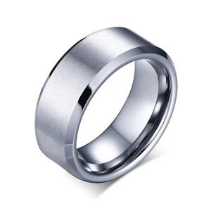 A silver-colored ring with a brushed, flat center band and polished beveled edges. The ring has a modern, minimalist design. The ring is a jewelry item.