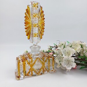 Art Deco Cut Glass Perfume Bottle with Amber Accents and Feather Stopper
