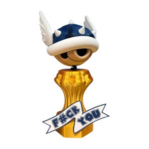 May include: A gold trophy with a blue and white winged shell design. The trophy has a banner with the text "F#CK YOU" in blue letters.