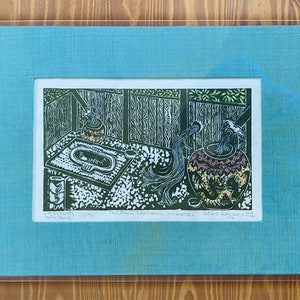 May include: A green and white woodblock print of a Japanese garden scene. The print depicts a small pond with a stone basin and a water spout pouring water into a large pot. The print is titled "Waterway to the Garden" and is signed by the artist.