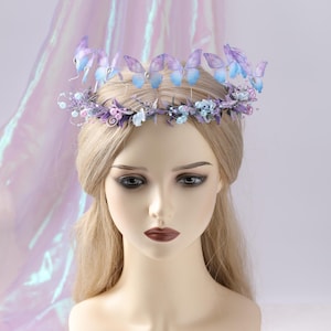 May include: A delicate butterfly crown featuring lavender and blue butterflies, accented with small flowers and beads. The crown is designed with a wire base and is suitable for special occasions or themed events.