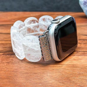 Side view of Apple Watch with elegant oval white crystal gemstone band, showcasing a clean, minimalist look.