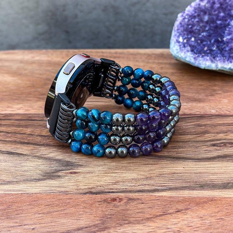 Designed to impress, this handmade Samsung Galaxy Watch Band combines Black Hematite, Purple Amethyst, and Blue Tiger Eye gemstones for a luxurious, one-of-a-kind accessory that enhances any look.