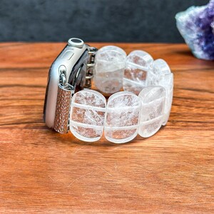 Handmade Apple Watch band from the side, featuring glossy oval white crystal stones with a soft shimmer.
